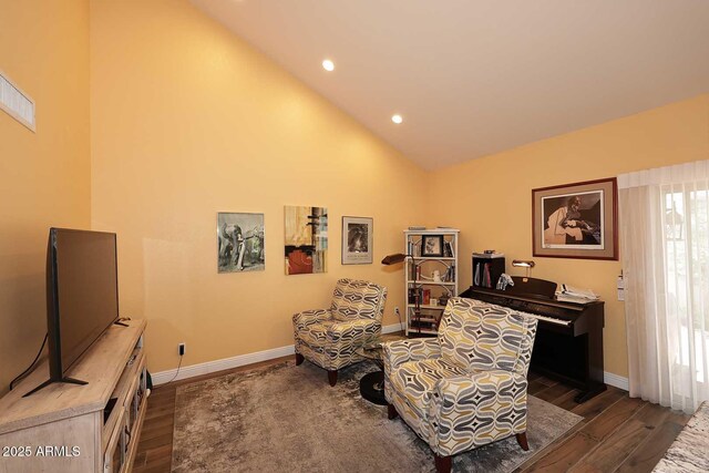 9235 N 101st St, Scottsdale, AZ 85258 - sitting room with wood finished floors, high vaulted ceiling, and recessed lighting
