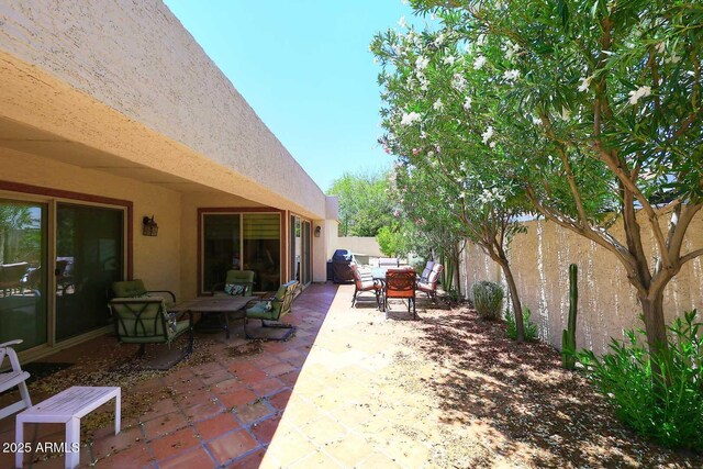 9235 N 101st St, Scottsdale, AZ 85258 - fenced backyard with a patio and outdoor dining area