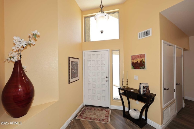9235 N 101st St, Scottsdale, AZ 85258 - entrance foyer featuring dark wood finished floors and a towering ceiling