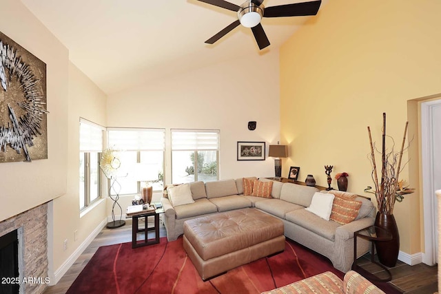 9235 N 101st St, Scottsdale, AZ 85258 - living room with ceiling fan, a premium fireplace, high vaulted ceiling, and dark wood-style floors
