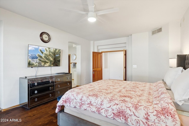 bedroom with ceiling fan and dark wood-type flooring