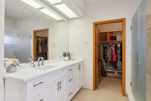 bathroom featuring tile patterned flooring and vanity