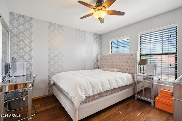 bedroom featuring ceiling fan and dark wood-type flooring