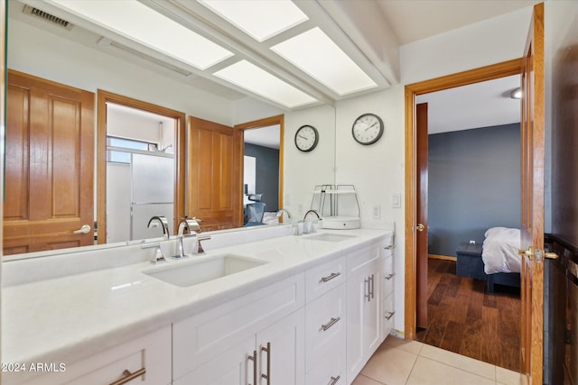 bathroom with vanity and tile patterned floors