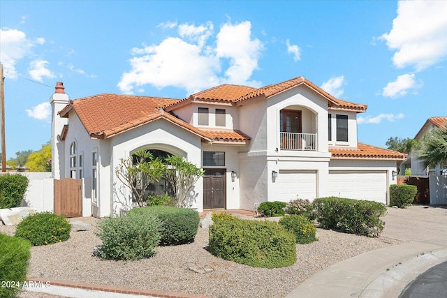 mediterranean / spanish-style house featuring a garage