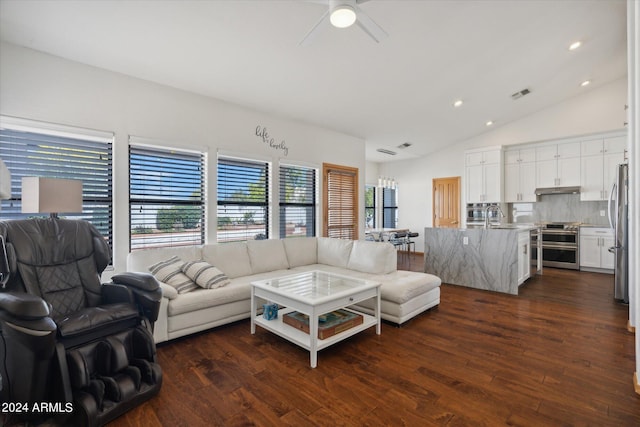 living room featuring ceiling fan, dark wood-type flooring, lofted ceiling, and sink