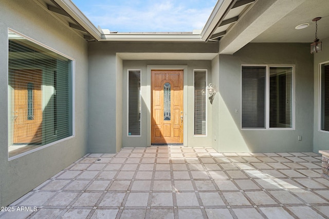 entrance to property with a patio