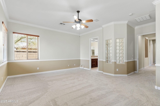 empty room with light carpet, ornamental molding, and ceiling fan