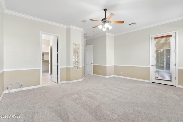 carpeted empty room featuring crown molding and ceiling fan