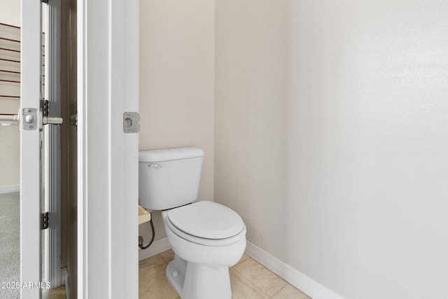 bathroom featuring tile patterned floors and toilet