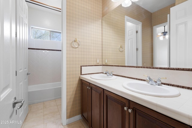 bathroom featuring ceiling fan, tile patterned floors, and vanity