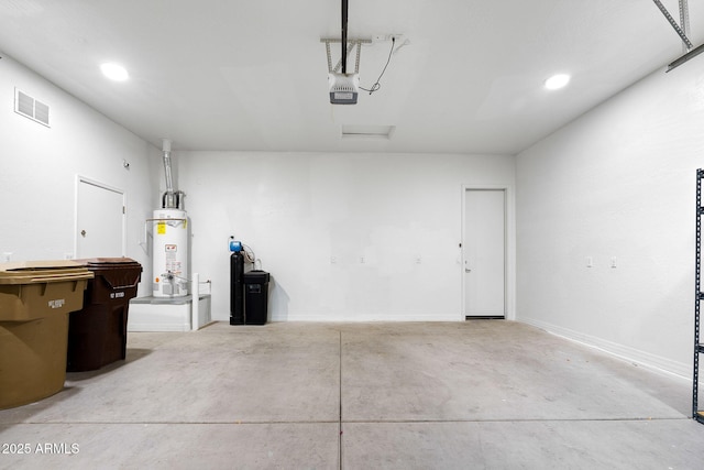 garage featuring a garage door opener and gas water heater