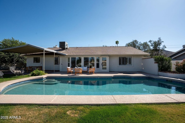 pool with central AC, outdoor lounge area, and a patio area