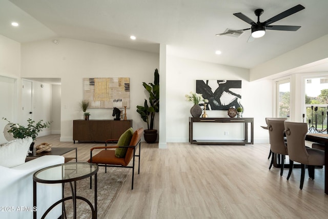 interior space featuring visible vents, recessed lighting, baseboards, light wood finished floors, and lofted ceiling