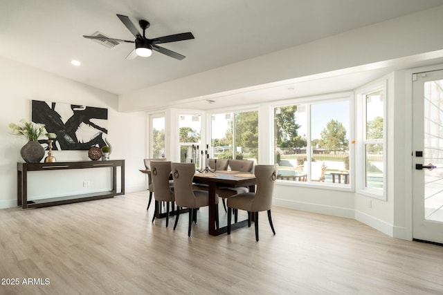 dining space with visible vents, plenty of natural light, and light wood-style floors