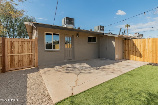 back of property with a patio and central air condition unit