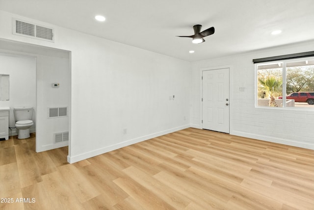 unfurnished room with ceiling fan and light hardwood / wood-style flooring