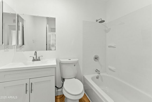 full bathroom with vanity, hardwood / wood-style flooring, shower / washtub combination, and toilet