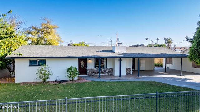 ranch-style home featuring a carport and a front yard