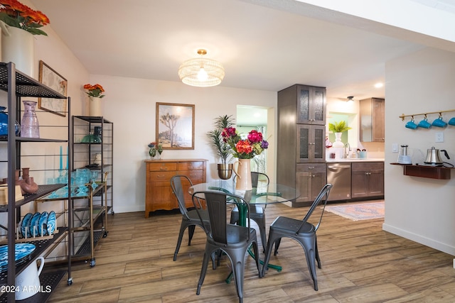 dining area featuring hardwood / wood-style floors and sink