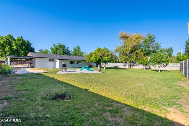 view of yard featuring a carport