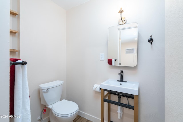 bathroom featuring sink and toilet