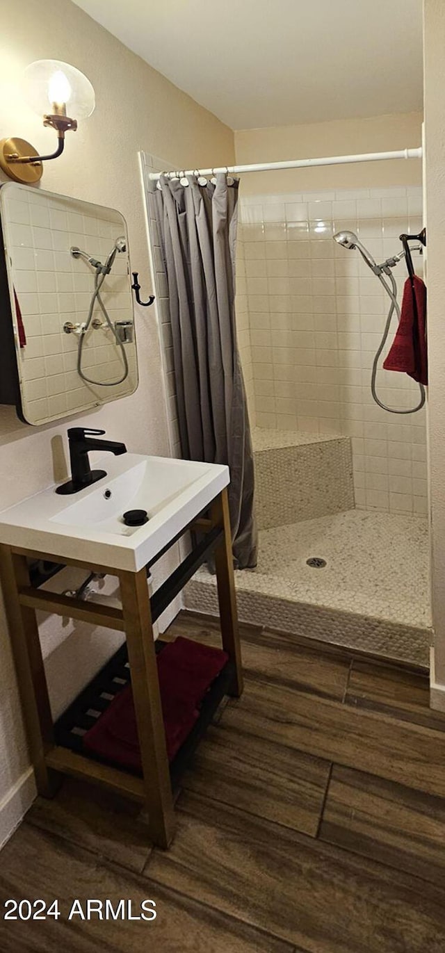 bathroom featuring a shower with curtain and wood-type flooring