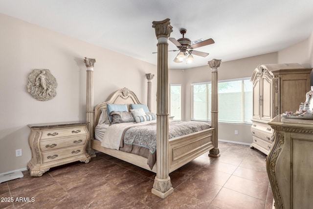 bedroom with baseboards and a ceiling fan