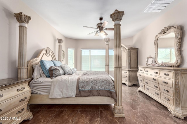 bedroom with decorative columns, a ceiling fan, and visible vents