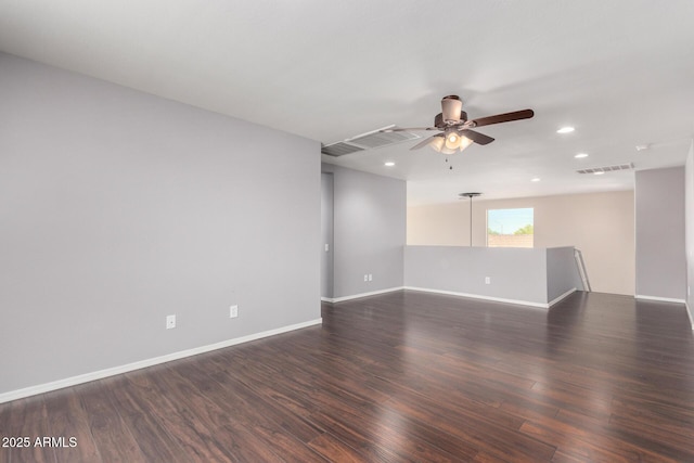 spare room featuring dark wood finished floors, baseboards, visible vents, ceiling fan, and recessed lighting