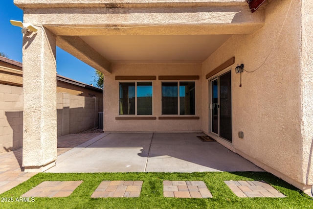 view of patio featuring fence