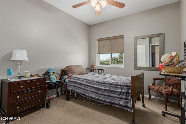 bedroom with ceiling fan and light carpet