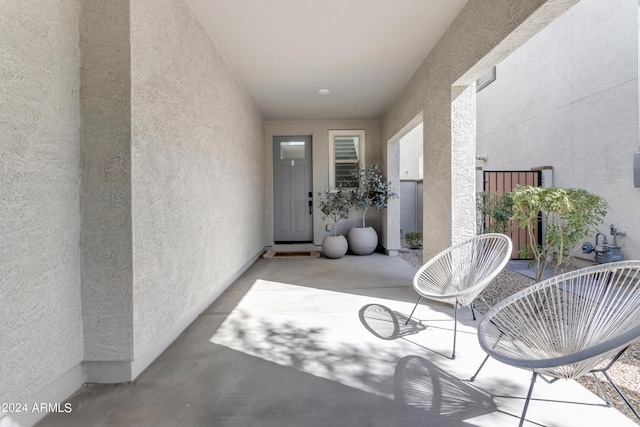 property entrance with a patio