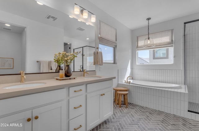 bathroom featuring independent shower and bath and vanity