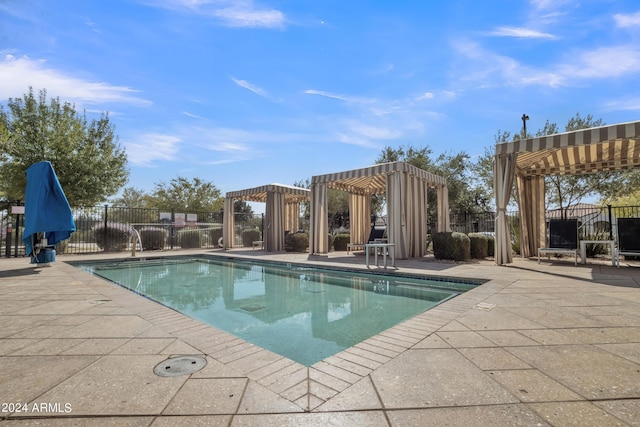 view of pool featuring a pergola and a patio