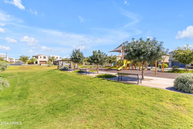 view of community with a lawn and a playground