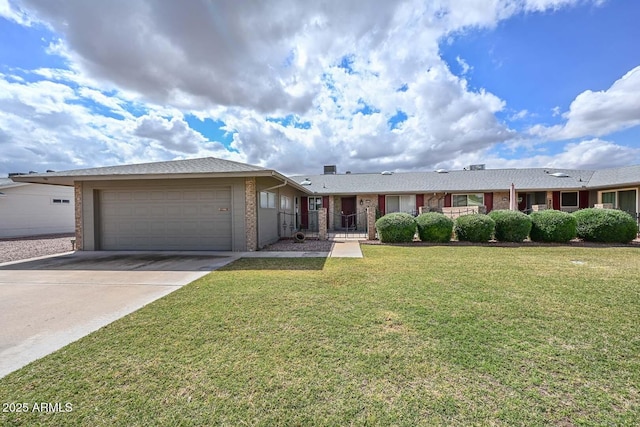 single story home featuring a front yard, a garage, brick siding, and driveway