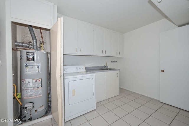 washroom featuring water heater, light tile patterned floors, cabinet space, washer / clothes dryer, and a sink