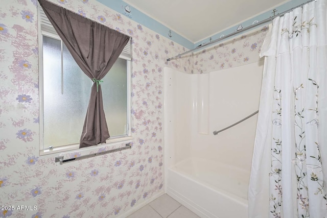 full bathroom featuring wallpapered walls, tile patterned floors, shower / bathtub combination with curtain, and baseboards