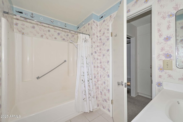 full bathroom with tile patterned floors, wallpapered walls, and shower / bath combo with shower curtain