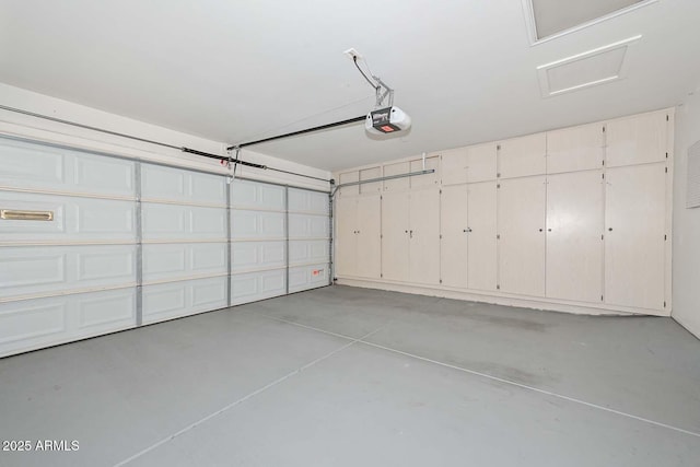 garage featuring a garage door opener