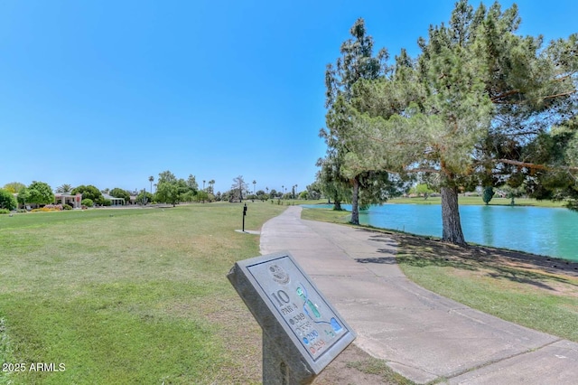 view of home's community featuring a yard and a water view