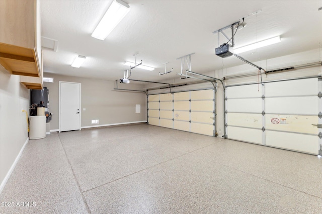 16615 N 109th Pl, Scottsdale, AZ 85255 - garage featuring baseboards and a garage door opener