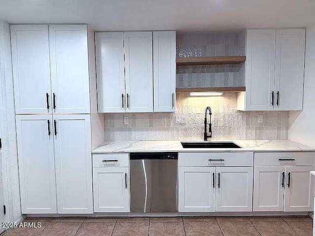 kitchen featuring a sink, light stone countertops, dishwasher, white cabinetry, and open shelves