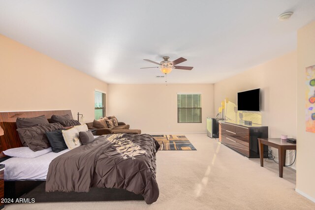 carpeted bedroom with ceiling fan