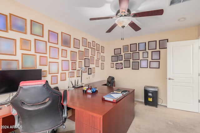 home office featuring light colored carpet and ceiling fan