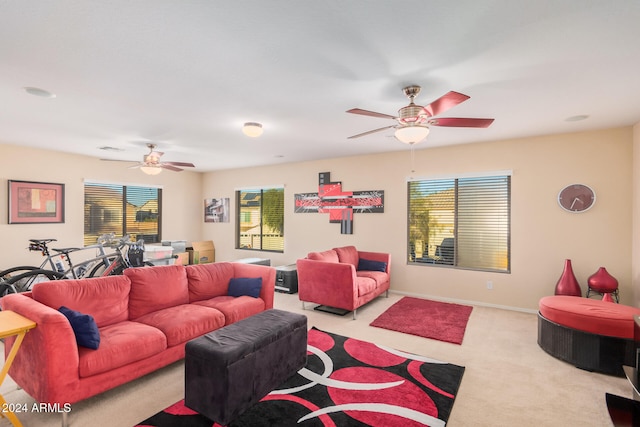 carpeted living room with ceiling fan