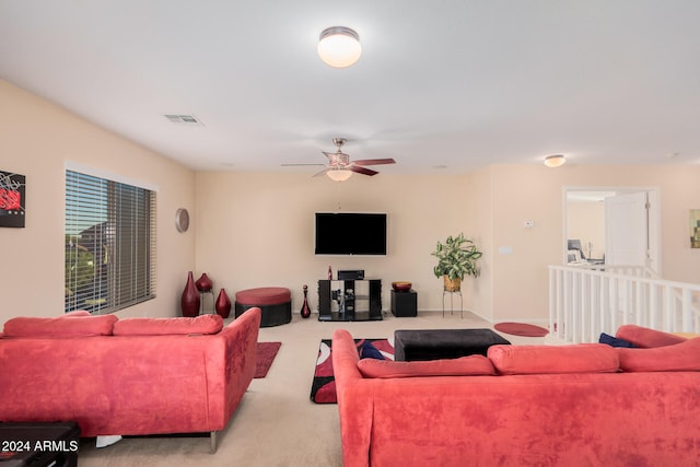 living room with light colored carpet and ceiling fan