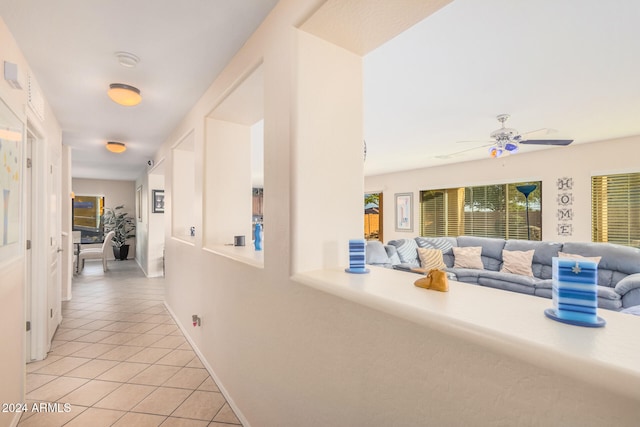 corridor featuring light tile patterned flooring