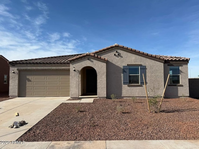 1418 E Jacqueline Pl, Casa Grande, AZ 85122 - mediterranean / spanish-style home featuring stucco siding, driveway, and an attached garage
